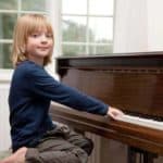child plays piano in Oak Park, CA